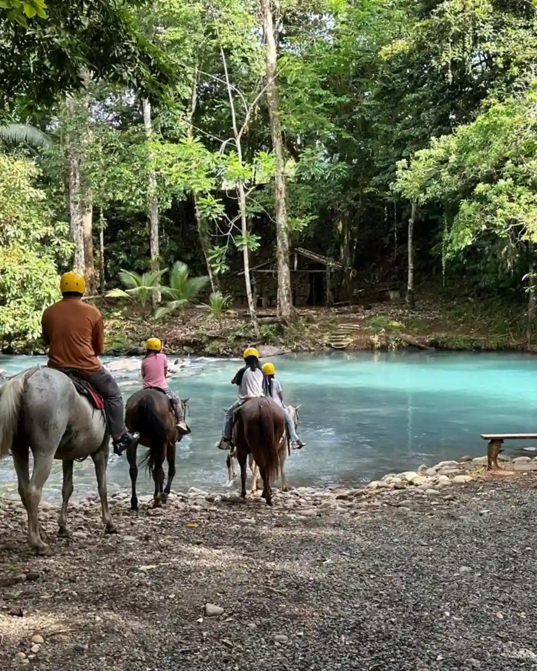Family on a private Rio Celeste horseback riding tour in Bijagua, Costa Rica